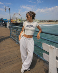 Women's Santa Monica Baby Tee – Santa Monica, California serif print by The Cali Store